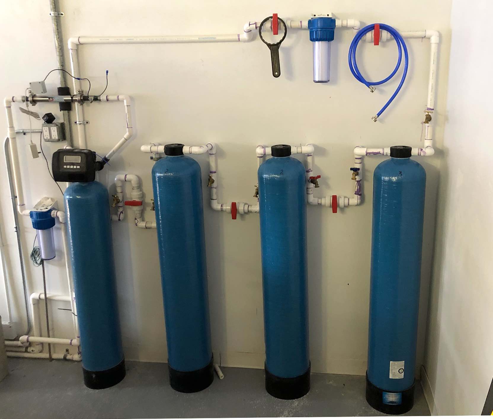 Fluoride removing whole-house filter system
